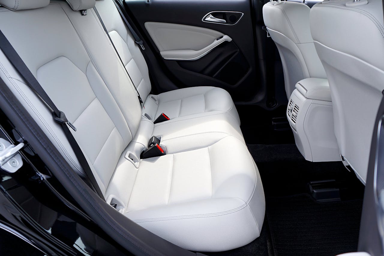 gallery-1 Explore the modern and luxurious feel of a car's interior with pristine white leather seats.